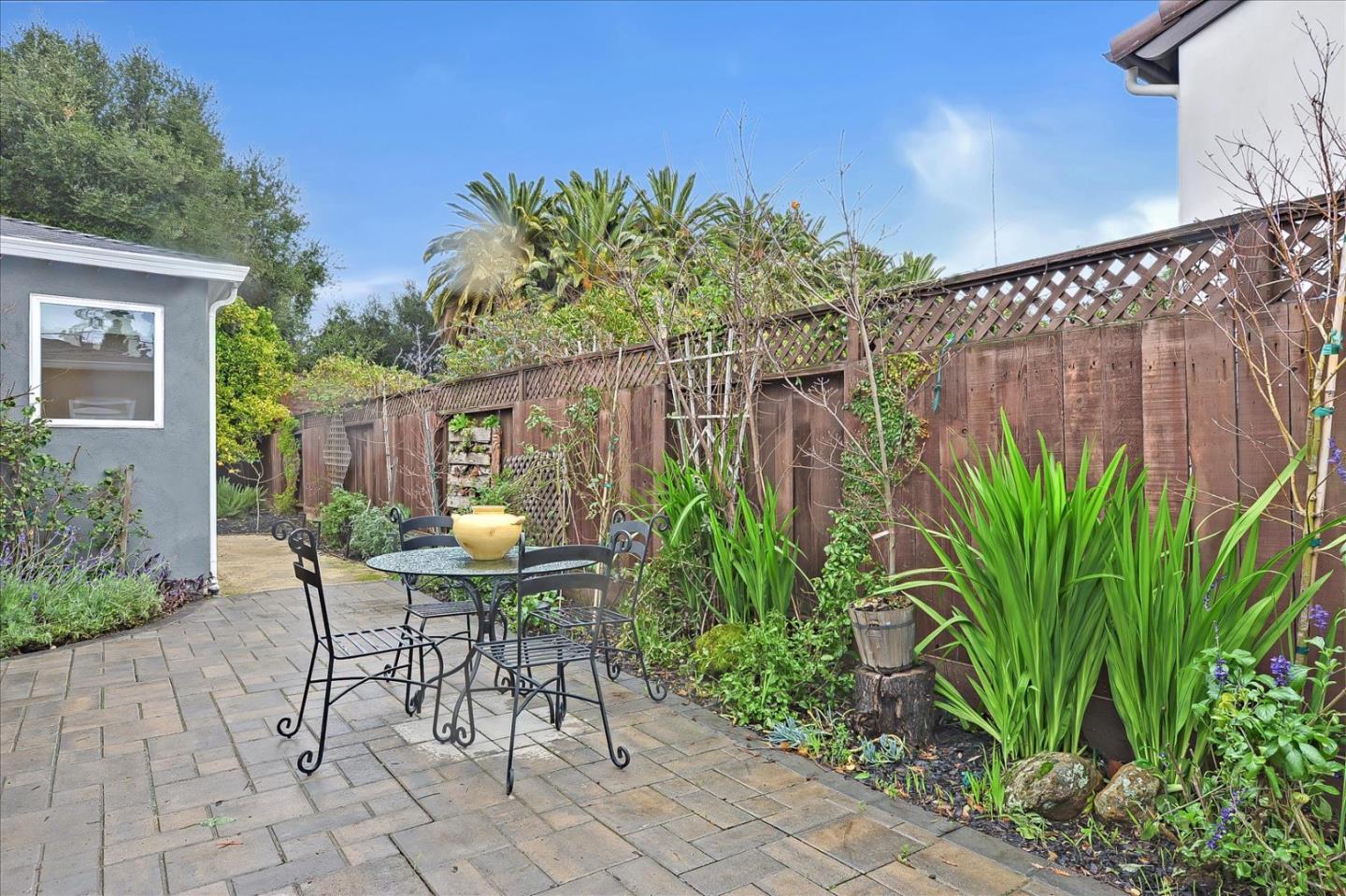 112 Haight Street Menlo Park, CA 94025 - Photo 44 of 47 a patio with table and chairs and potted plants