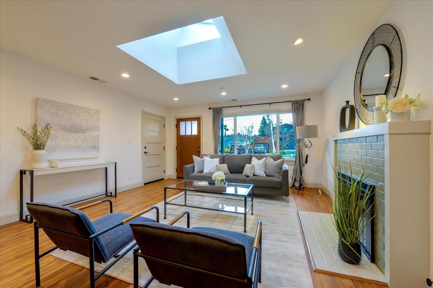 112 Haight Street Menlo Park, CA 94025 - Photo 5 of 47 a living room with furniture a fireplace and a potted plant