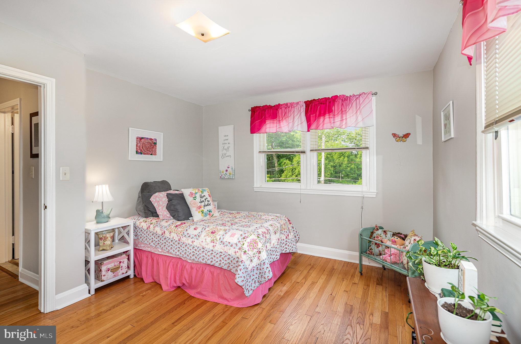 200 Riverthorn Road Middle River, MD 21220 - Photo 16 of 46 a bedroom with a bed and a window