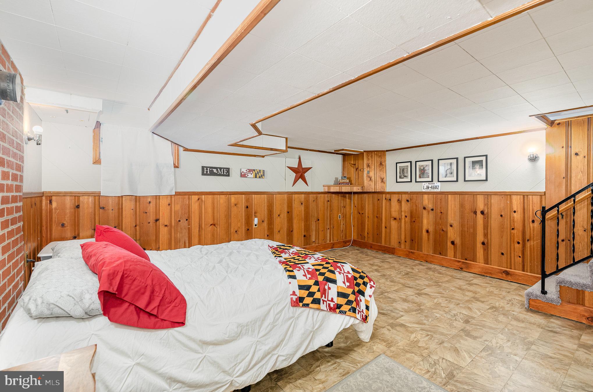 200 Riverthorn Road Middle River, MD 21220 - Photo 25 of 46 a bed room with a bed and a couch