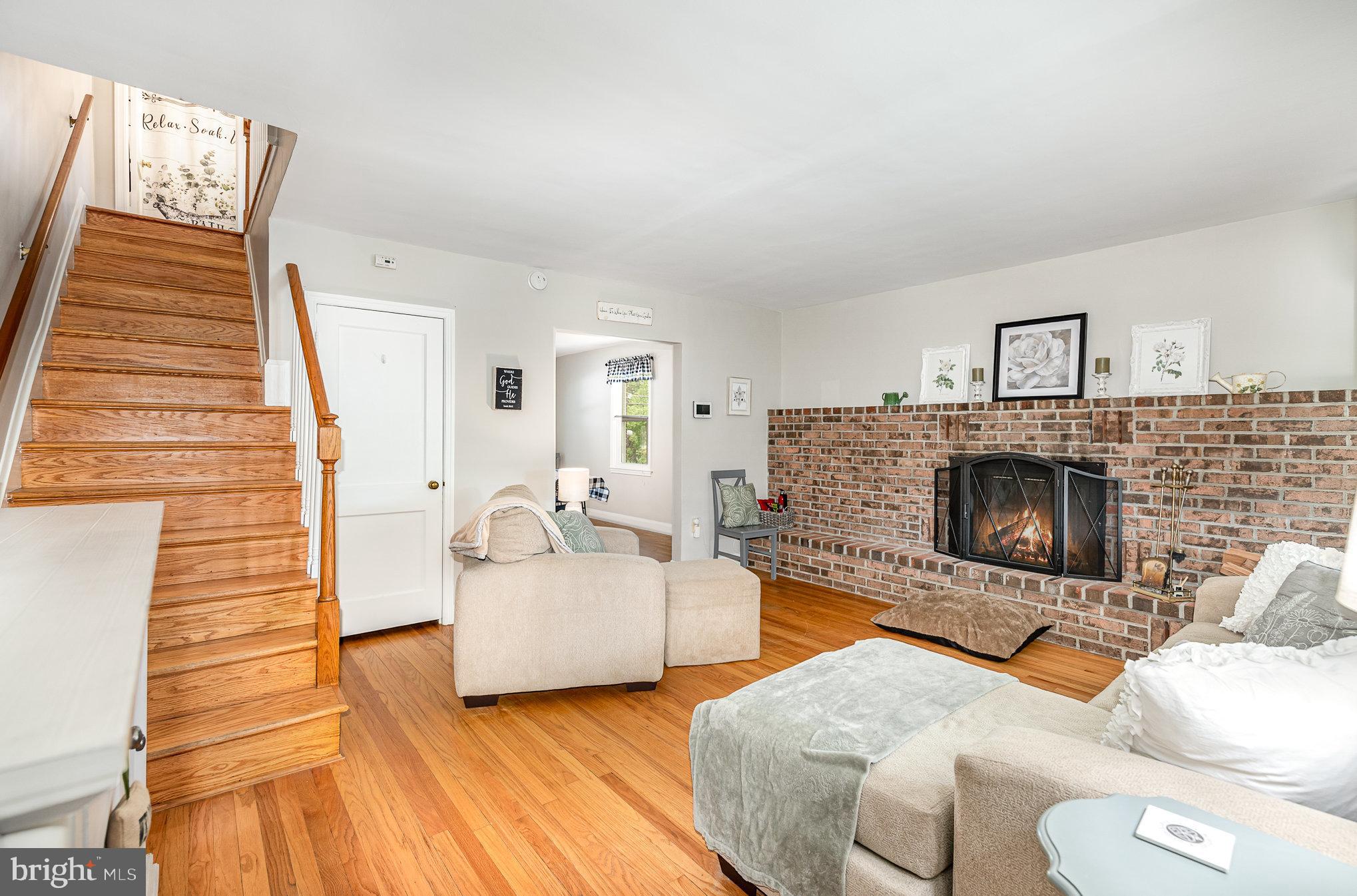 200 Riverthorn Road Middle River, MD 21220 - Photo 6 of 46 a living room with furniture and a fireplace
