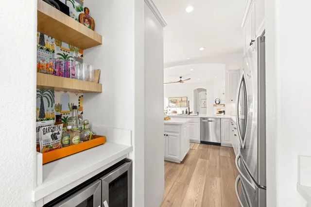 a view of a hallway with washer and dryer
