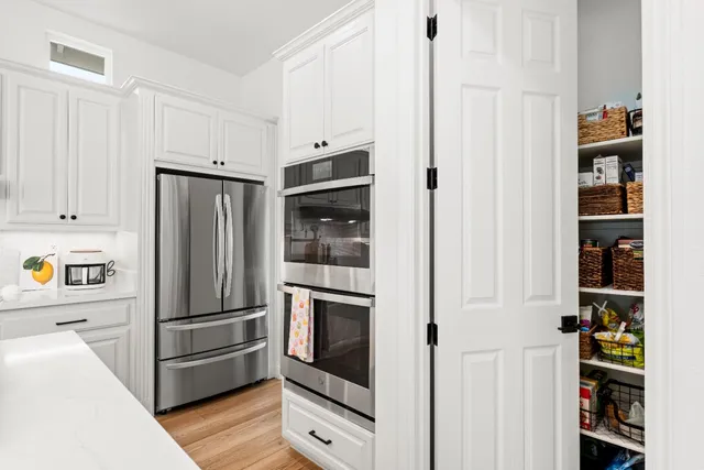 a bedroom with a bed and flat screen tv