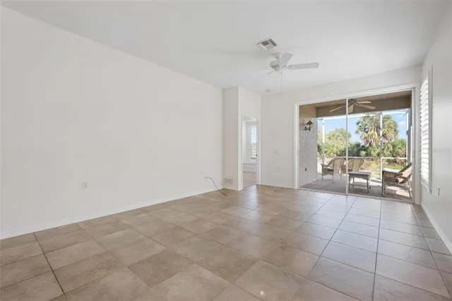 a kitchen with stainless steel appliances kitchen island granite countertop a table and chairs in it