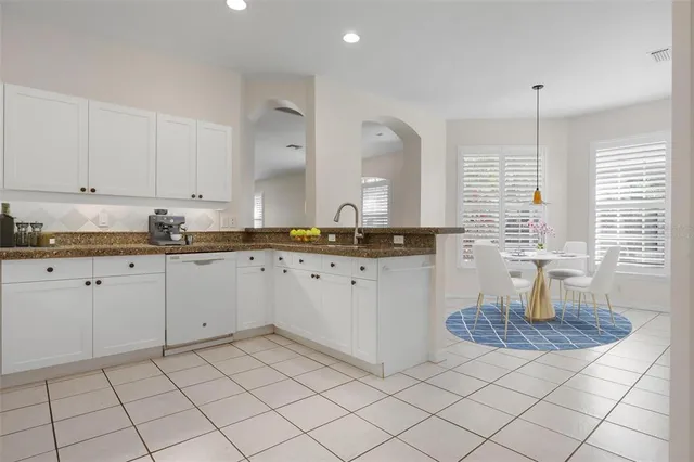 a bathroom with a shower sink and mirror