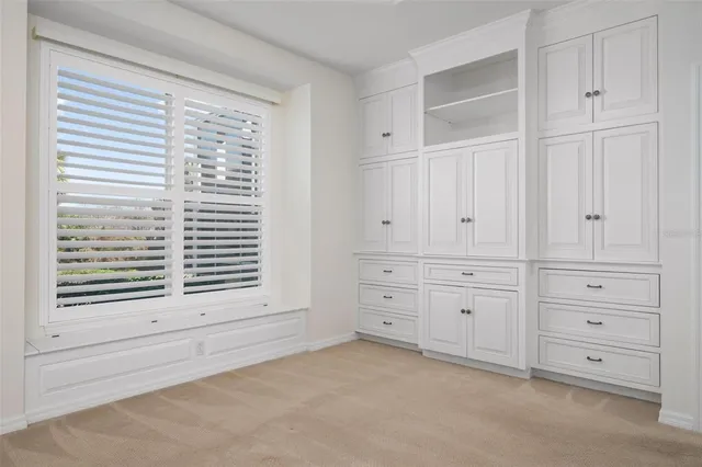 a view of a chairs and table in the balcony
