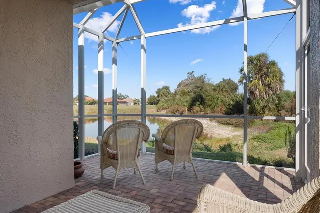 a view of a house with large trees