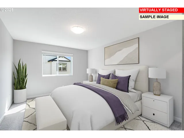 a bedroom with a bed and a painting on the wall