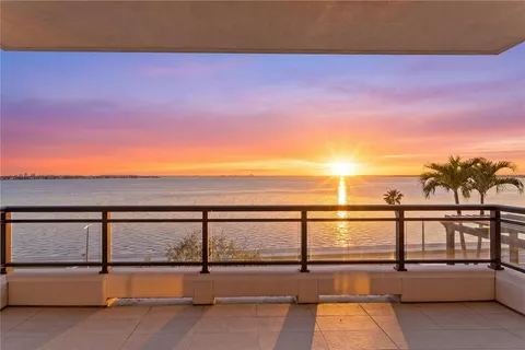a view of a chairs and table in the balcony