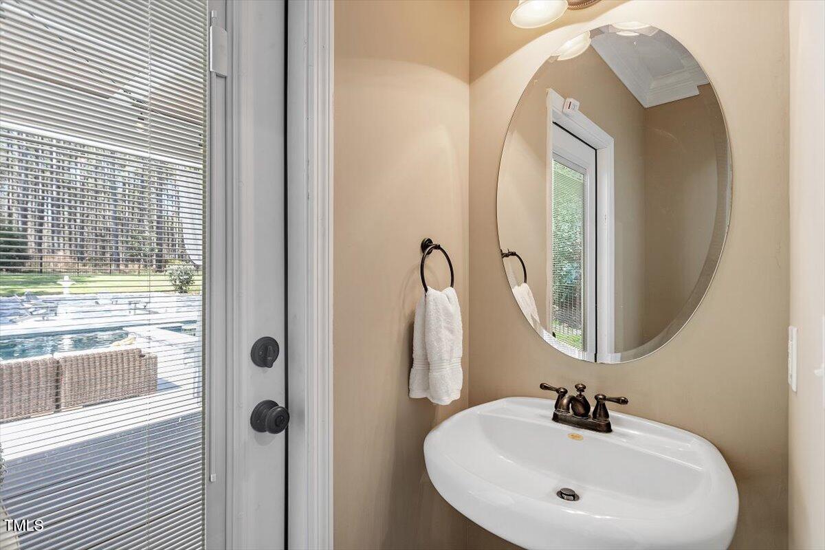 3504 Griffice Mill Road Raleigh, NC 27610 - Photo 16 of 39 a bathroom with a sink and a mirror