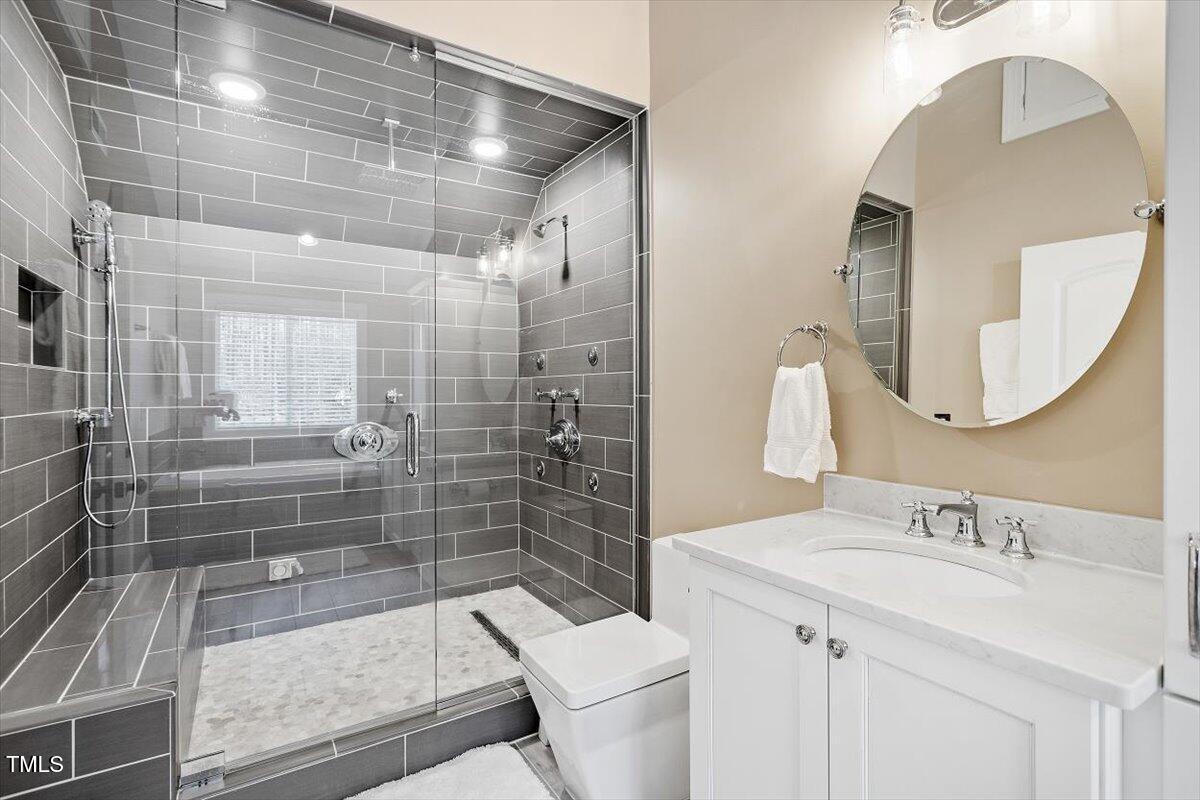 3504 Griffice Mill Road Raleigh, NC 27610 - Photo 19 of 39 a bathroom with a sink and a mirror
