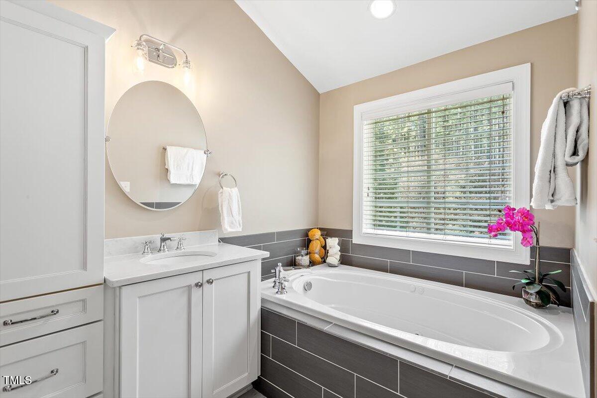 3504 Griffice Mill Road Raleigh, NC 27610 - Photo 20 of 39 a bathroom with a sink and a bathtub
