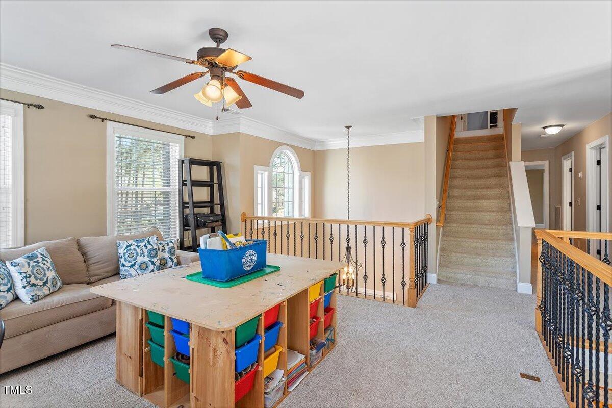 3504 Griffice Mill Road Raleigh, NC 27610 - Photo 25 of 39 a living room with furniture and window