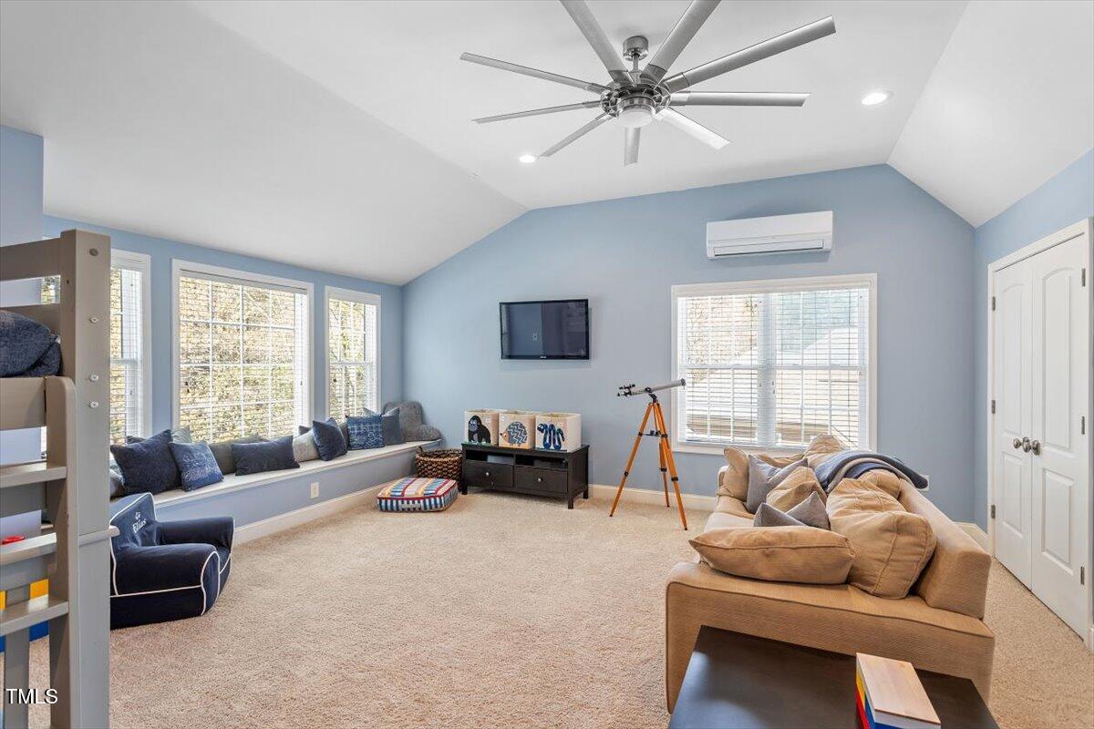3504 Griffice Mill Road Raleigh, NC 27610 - Photo 26 of 39 a living room with furniture and a large window