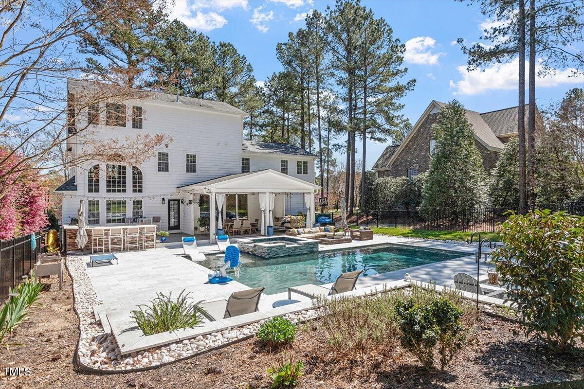 3504 Griffice Mill Road Raleigh, NC 27610 - Photo 35 of 39 a view of a house with swimming pool and sitting area