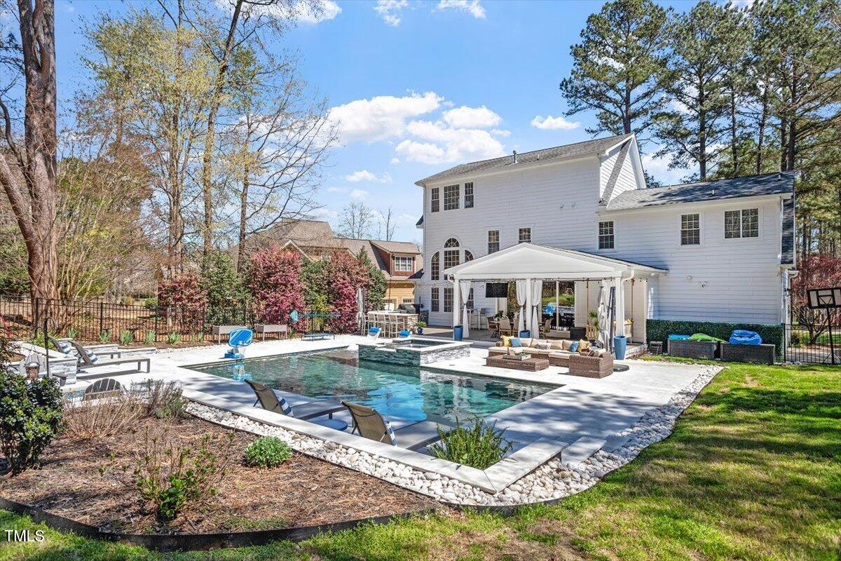 3504 Griffice Mill Road Raleigh, NC 27610 - Photo 36 of 39 a table and chairs under an umbrella