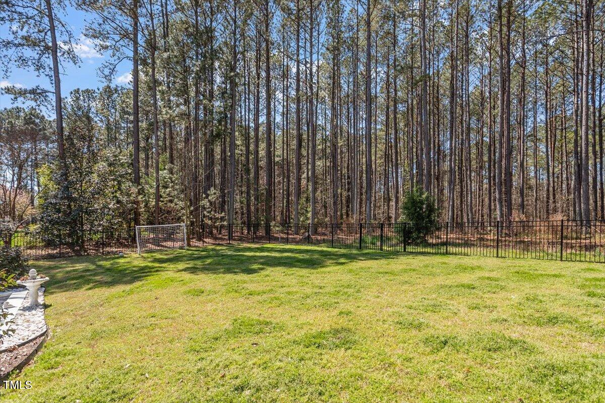 3504 Griffice Mill Road Raleigh, NC 27610 - Photo 37 of 39 a swimming pool with outdoor seating and yard