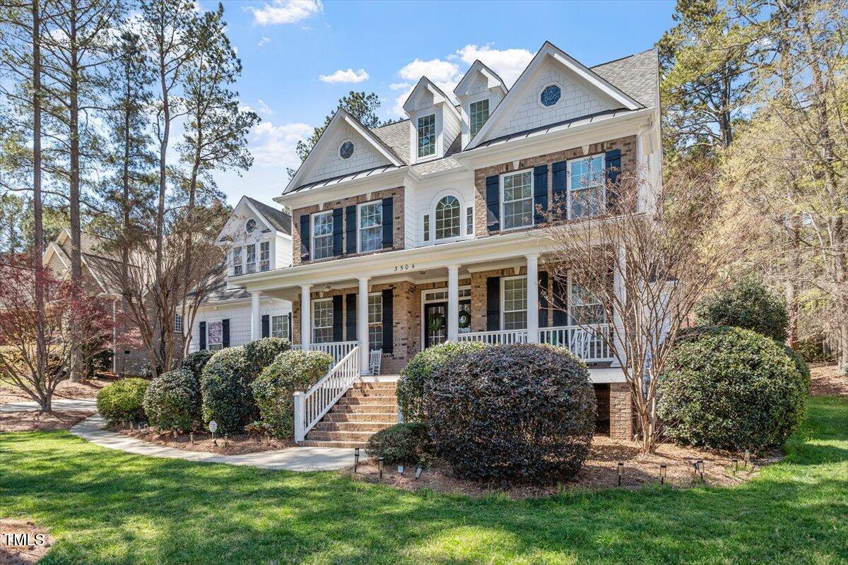3504 Griffice Mill Road Raleigh, NC 27610 - Photo 38 of 39 a front view of a house with a yard
