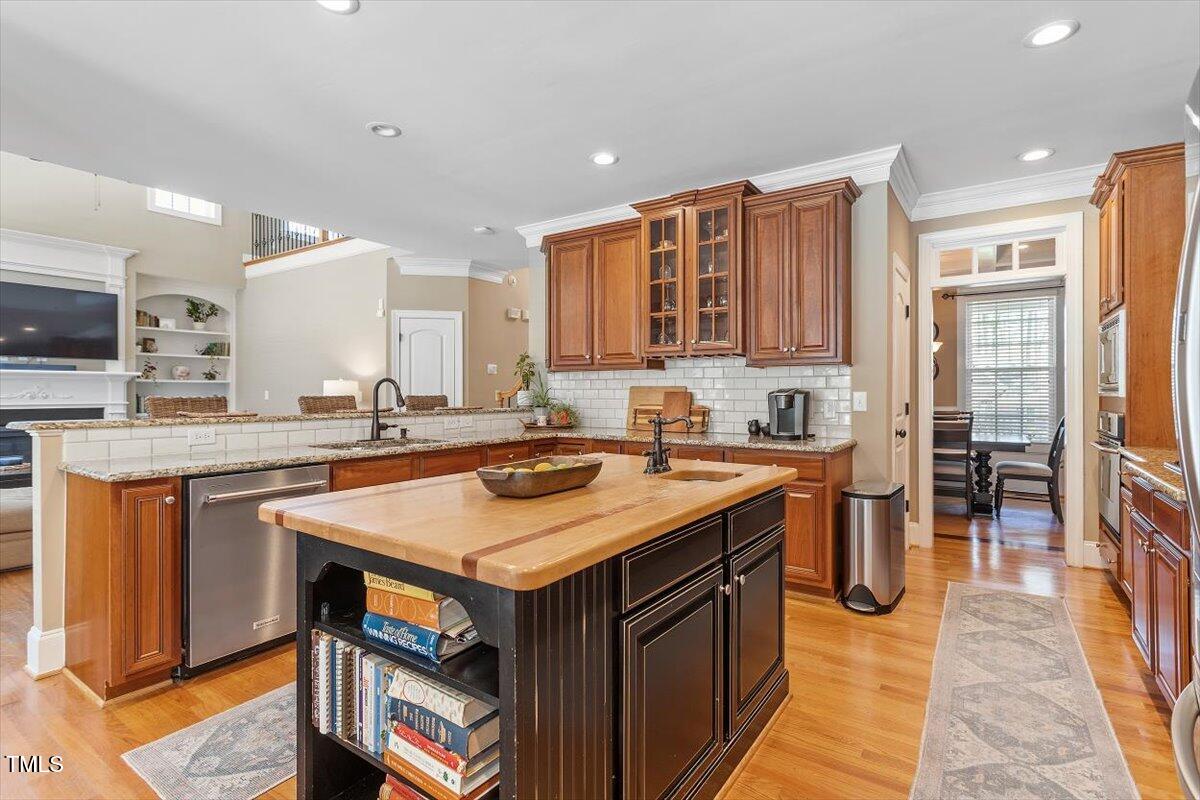 3504 Griffice Mill Road Raleigh, NC 27610 - Photo 8 of 39 a kitchen with stainless steel appliances granite countertop a sink and a refrigerator