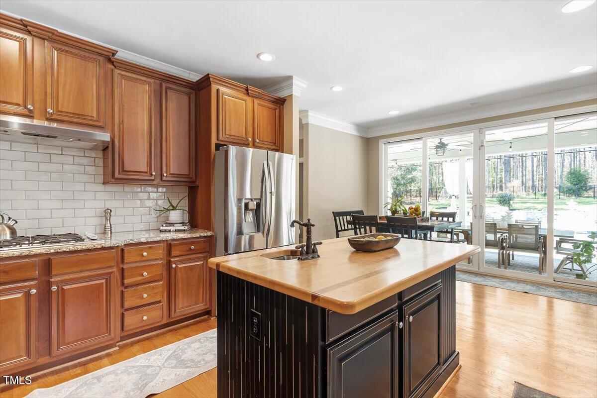 3504 Griffice Mill Road Raleigh, NC 27610 - Photo 10 of 39 a kitchen with stainless steel appliances granite countertop a sink a stove and a refrigerator