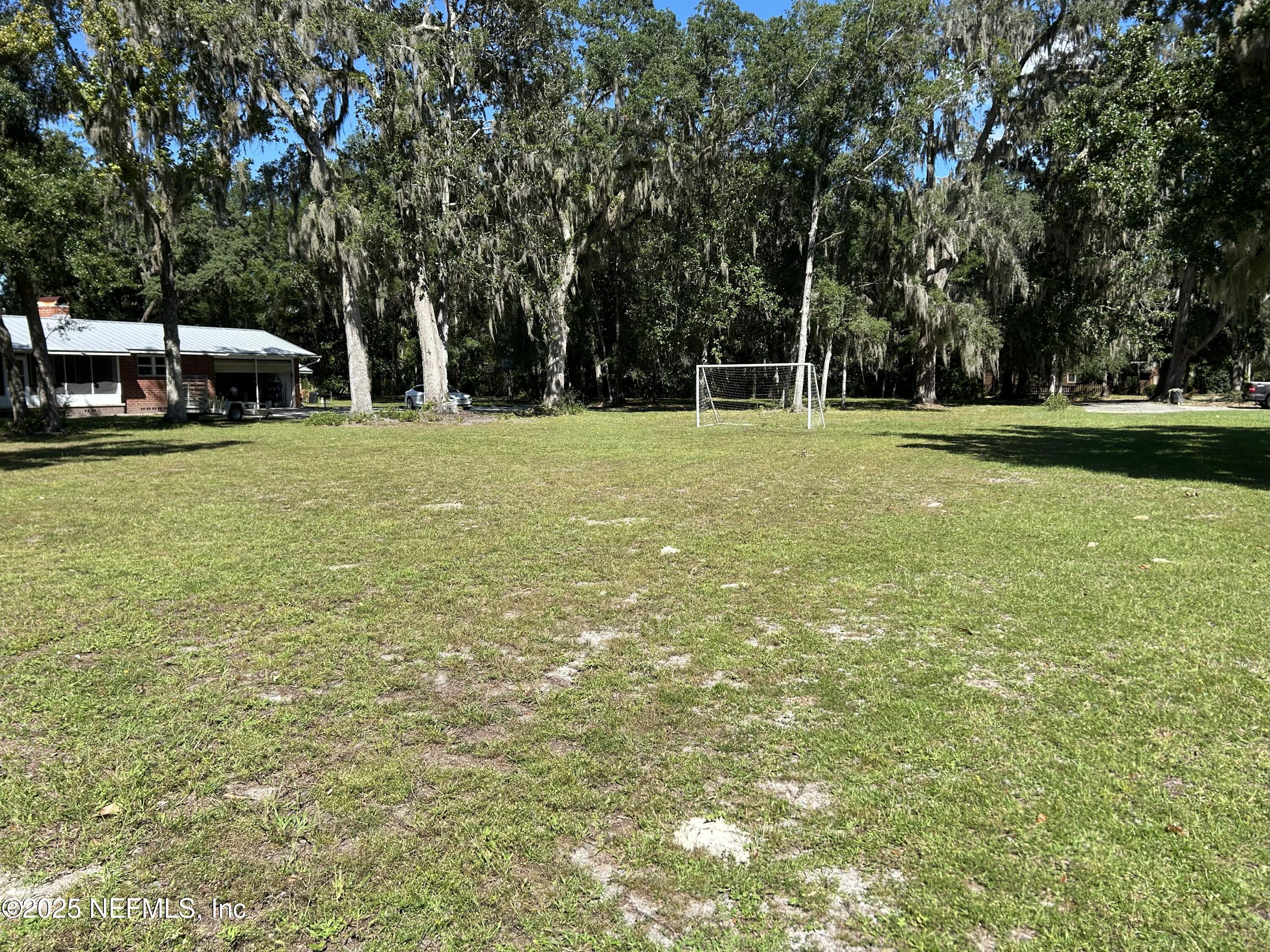 940 Myron Road Jacksonville, FL 32259 - Photo 13 of 20 a view of a house with backyard and trees