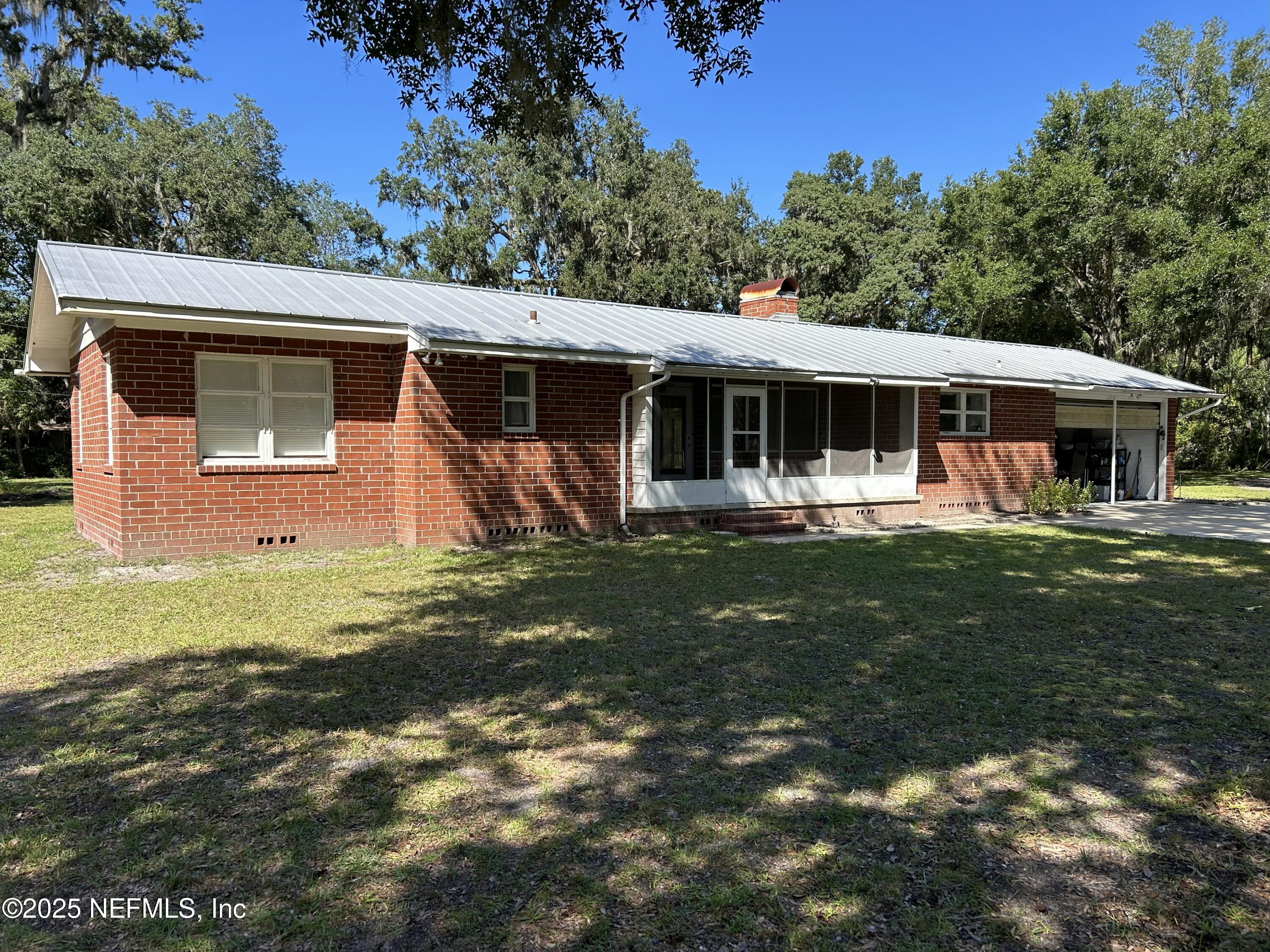 940 Myron Road Jacksonville, FL 32259 - Photo 2 of 20 a front view of a house with garden