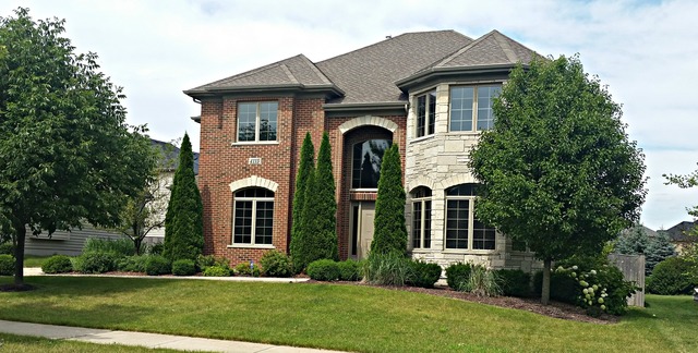 4115 Champion Road Naperville, IL 60564 - Photo 1 of 18 front view of a house with a yard