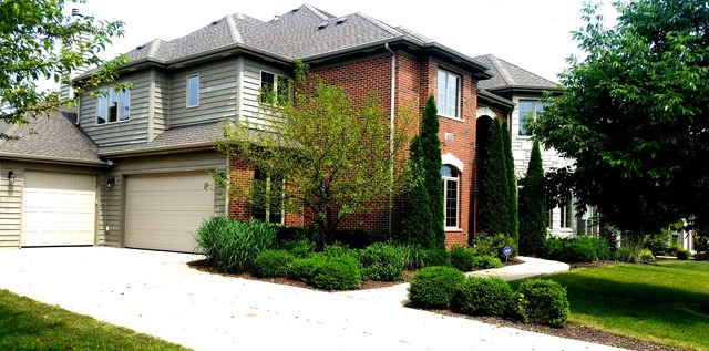 4115 Champion Road Naperville, IL 60564 - Photo 2 of 18 a house that has a tree in front of the house