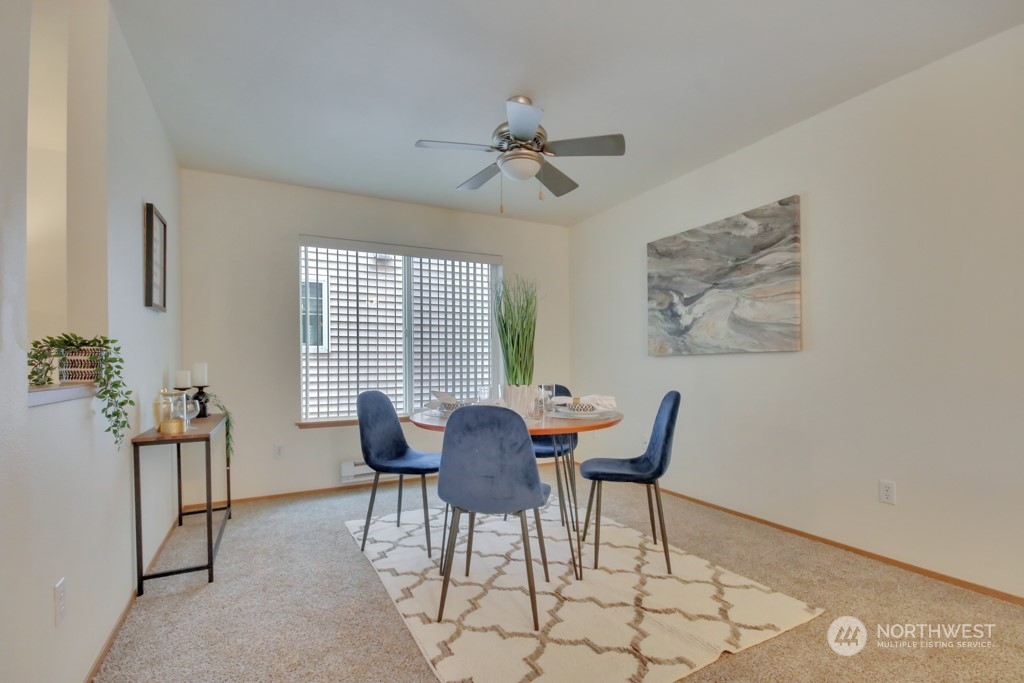 4010 East R Street Tacoma, WA 98404 - Photo 14 of 28 a view of a dining room with furniture and a chandelier