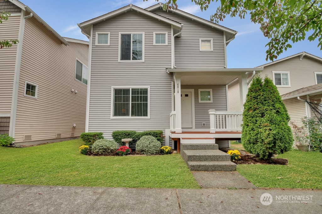 4010 East R Street Tacoma, WA 98404 - Photo 2 of 28 a front view of a house with a garden