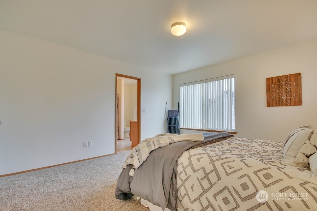4010 East R Street Tacoma, WA 98404 - Photo 25 of 28 a bedroom with a bed and a window