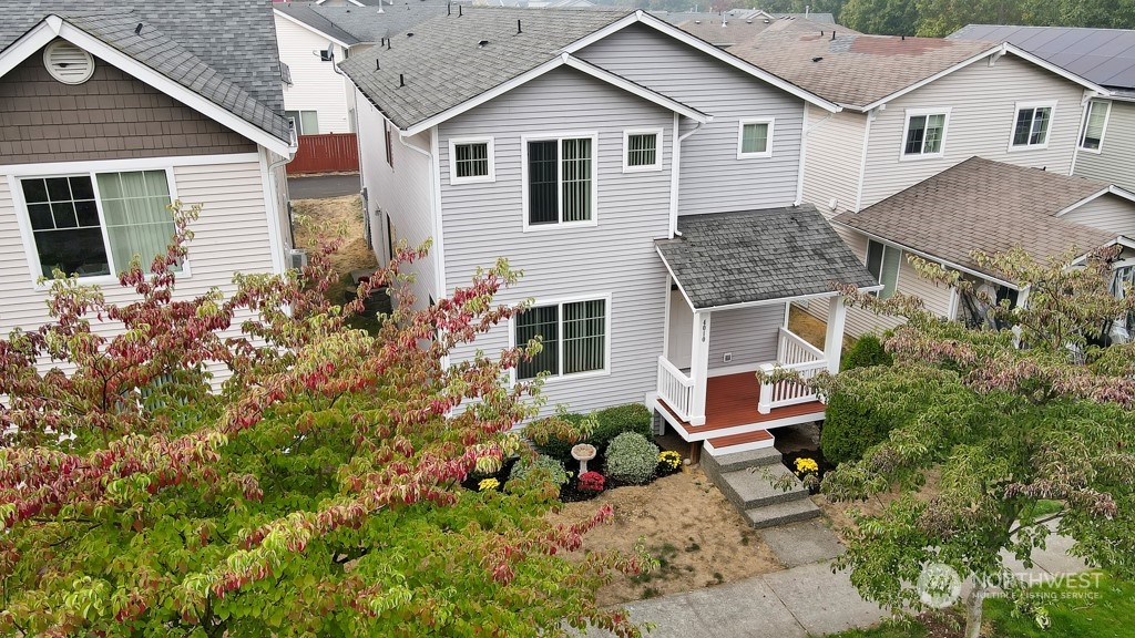 4010 East R Street Tacoma, WA 98404 - Photo 28 of 28 a front view of a house with a yard and potted plants