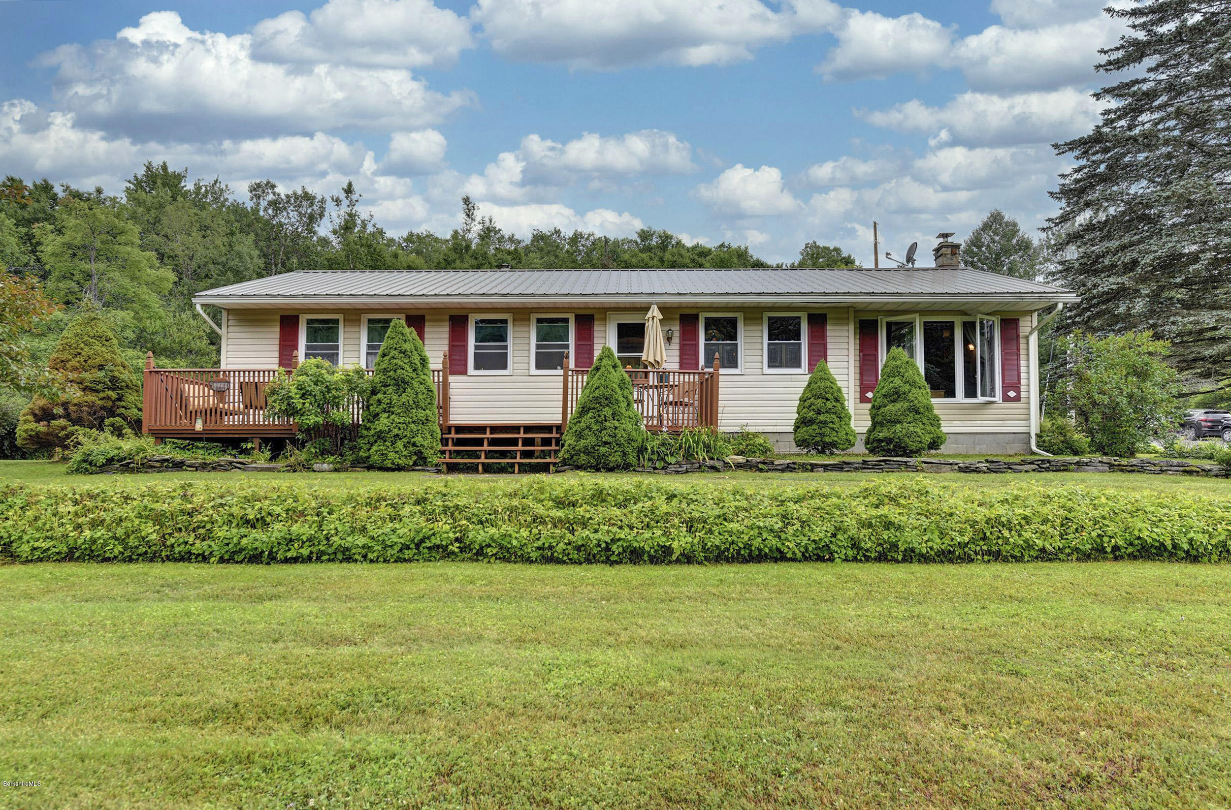 373 Haskins Road Savoy, MA 01256 - Photo 1 of 34 a front view of a house with a garden