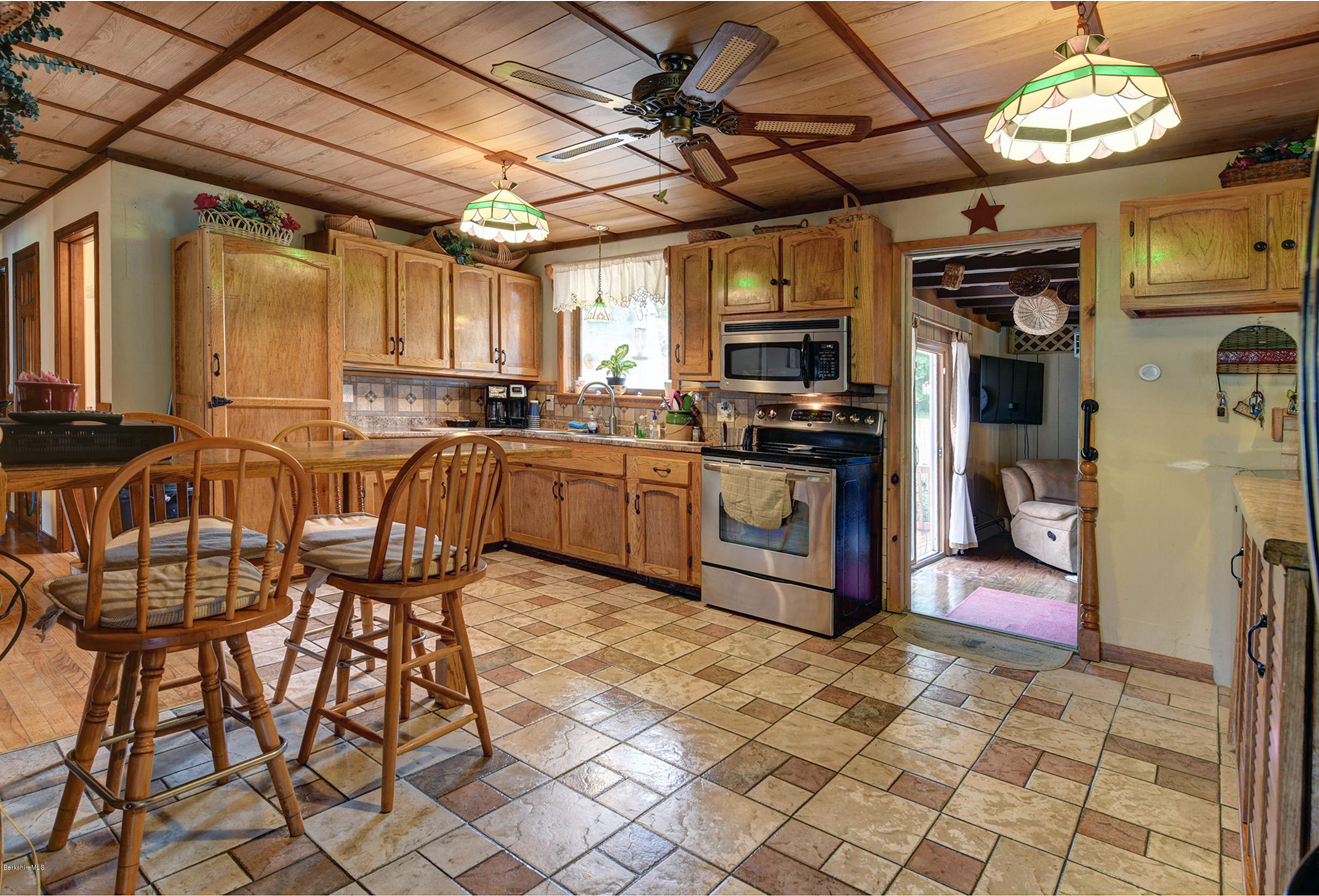 373 Haskins Road Savoy, MA 01256 - Photo 12 of 34 a kitchen with stainless steel appliances granite countertop a stove a sink and a refrigerator