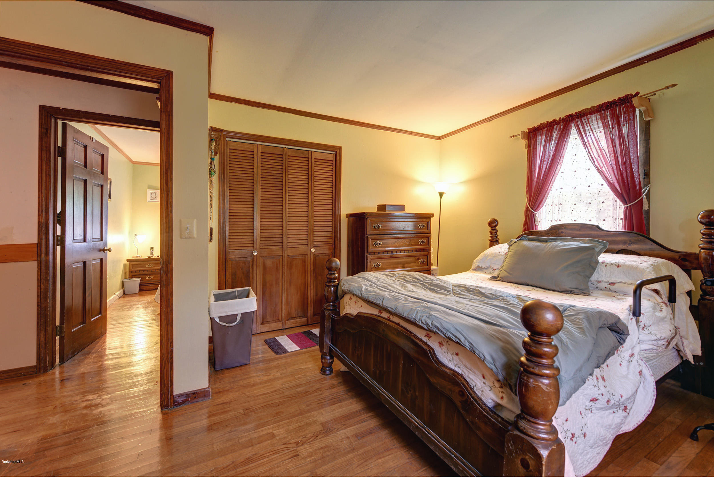 373 Haskins Road Savoy, MA 01256 - Photo 16 of 34 a bedroom with a bed and wooden floor
