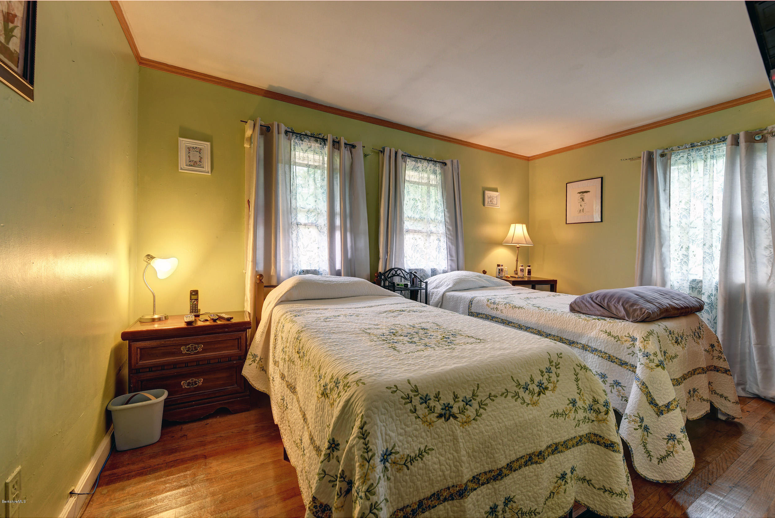 373 Haskins Road Savoy, MA 01256 - Photo 17 of 34 a bed sitting in a bedroom next to a window