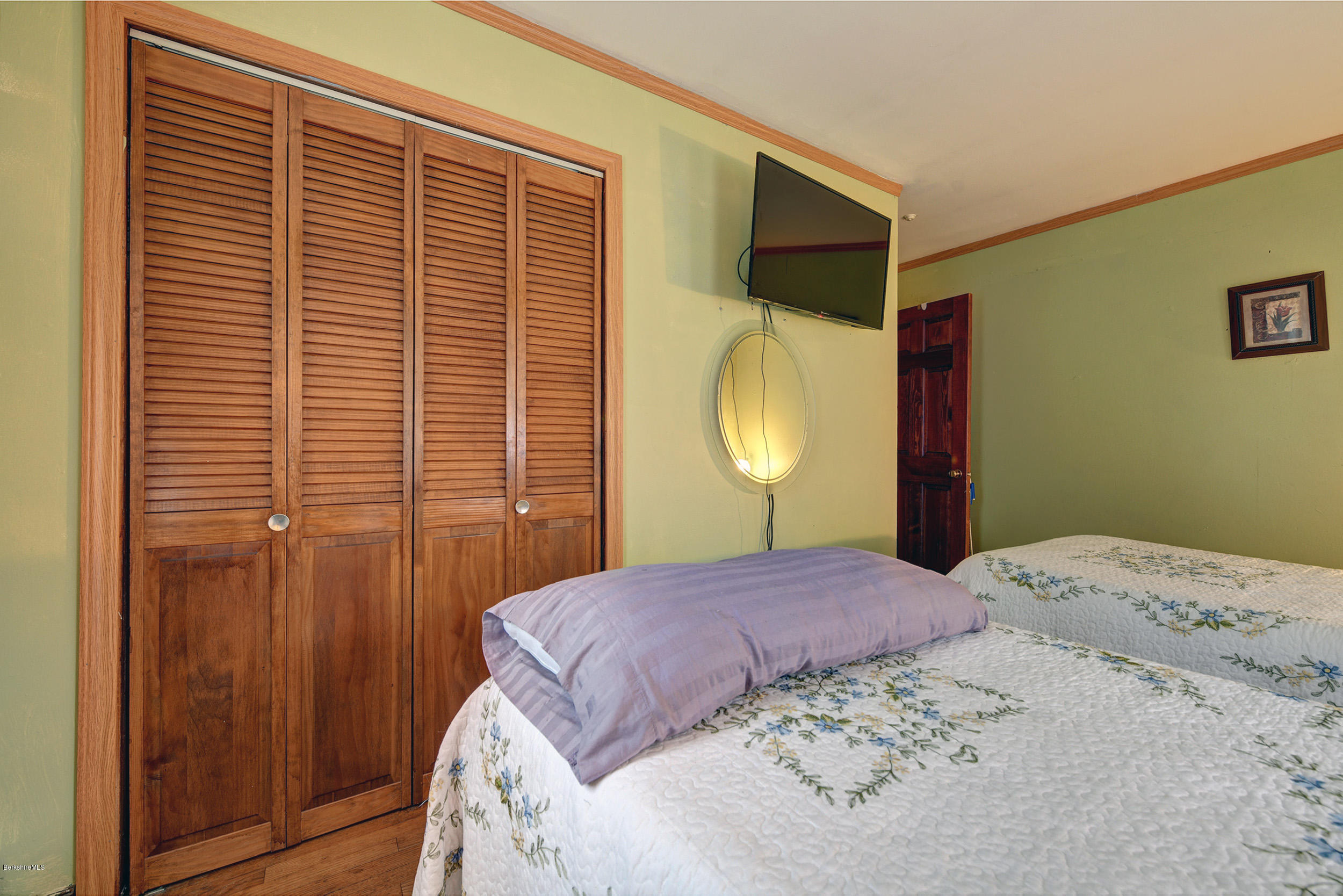 373 Haskins Road Savoy, MA 01256 - Photo 18 of 34 a bedroom with a large bed and a window