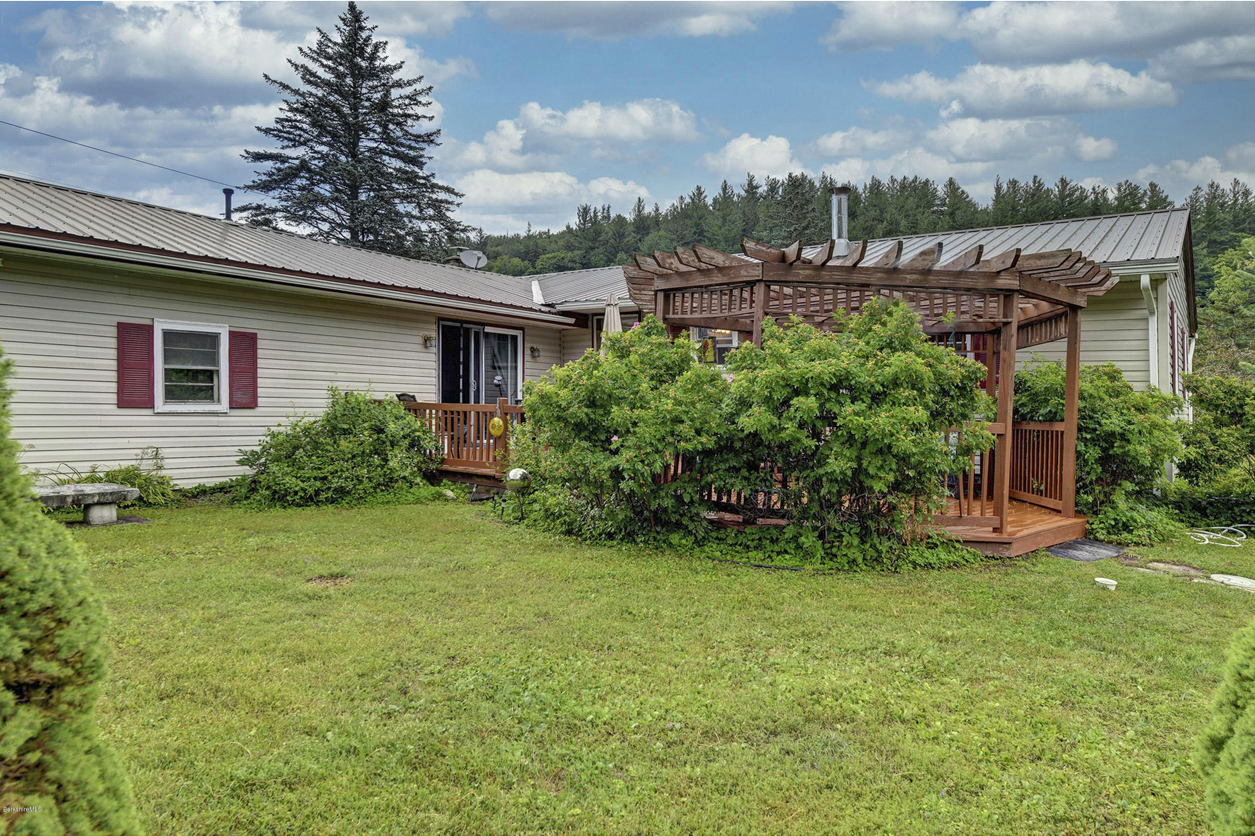 373 Haskins Road Savoy, MA 01256 - Photo 24 of 34 a view of a house with a backyard and plants