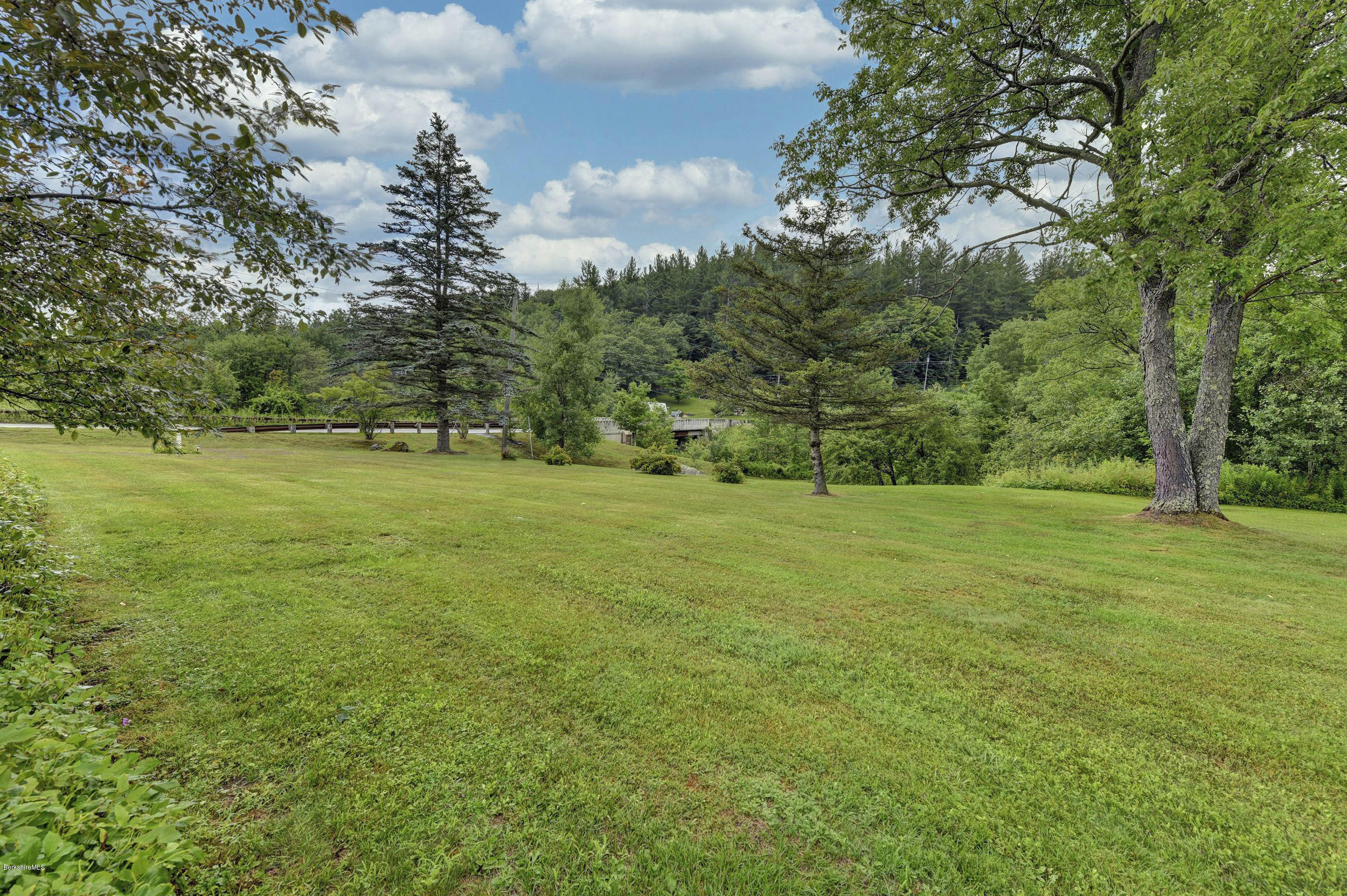 373 Haskins Road Savoy, MA 01256 - Photo 28 of 34 a view of a field with trees in the background