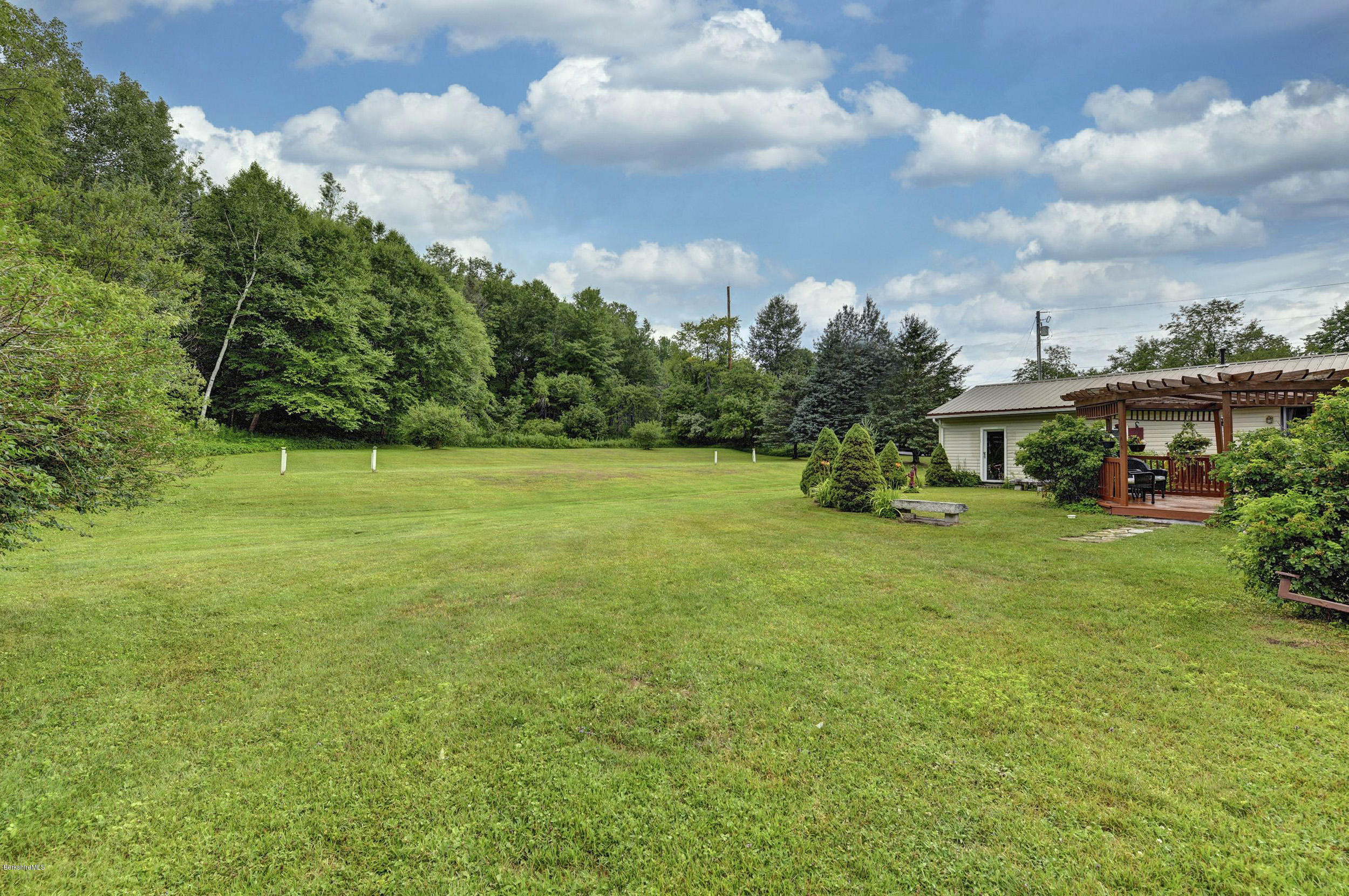 373 Haskins Road Savoy, MA 01256 - Photo 29 of 34 a front view of a house with a garden