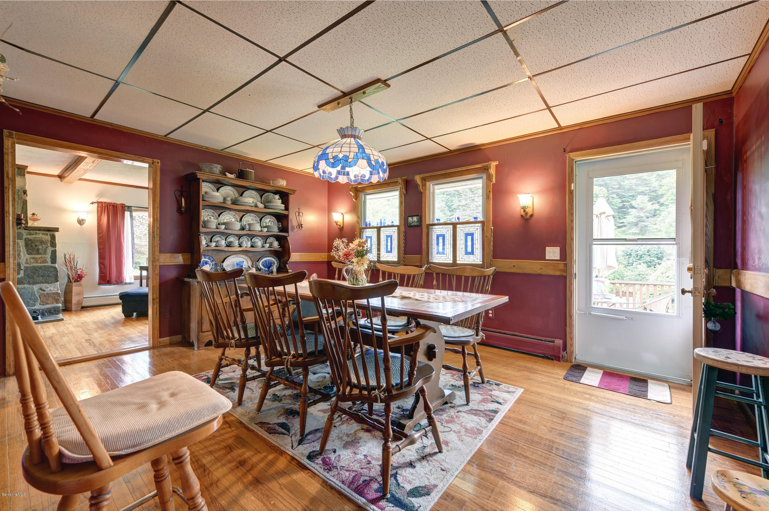 373 Haskins Road Savoy, MA 01256 - Photo 9 of 34 a view of a dining room with furniture window and wooden floor