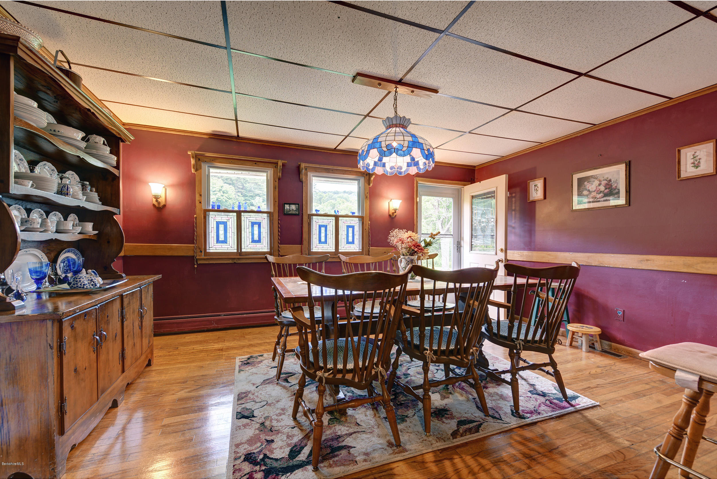 373 Haskins Road Savoy, MA 01256 - Photo 10 of 34 a view of a dining room with furniture and chandelier