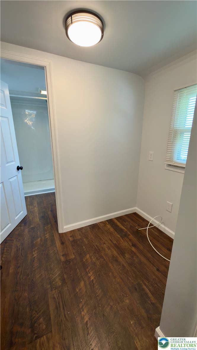246 Poplar Street Bath, PA 18014 - Photo 28 of 34 Rich hardwood-style flooring extends into this versatile room, leading to an adjacent bathing area.