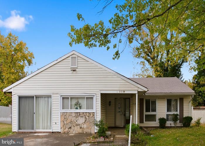 2409 Mary Place Fort Washington, MD 20744 - Photo 1 of 18 a view of a white house with a yard