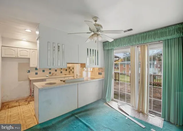 a view of a room with a fan