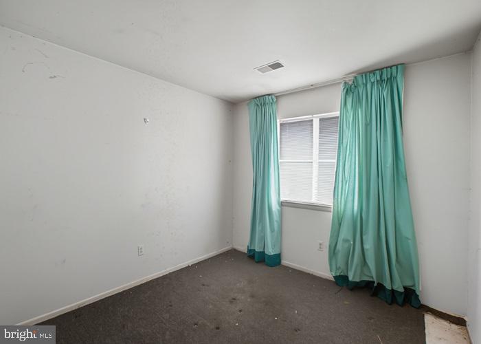 2409 Mary Place Fort Washington, MD 20744 - Photo 13 of 18 an empty room with a window and stairs