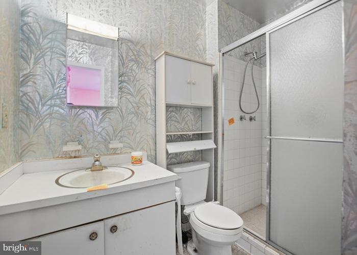 2409 Mary Place Fort Washington, MD 20744 - Photo 18 of 18 a bathroom with a sink toilet and shower