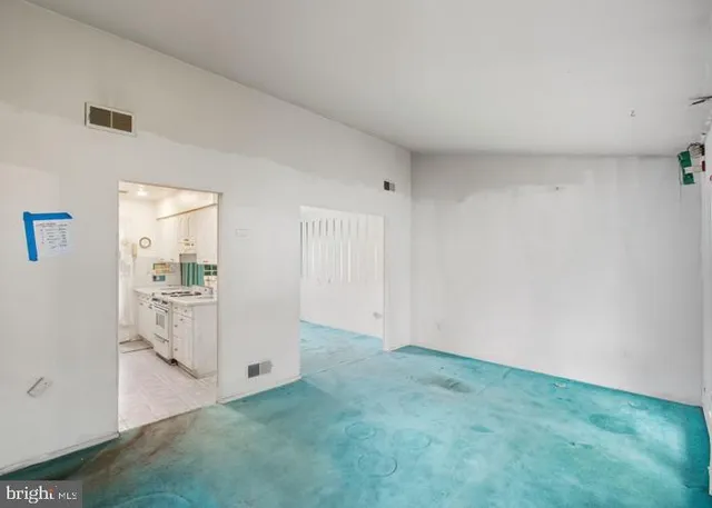a large kitchen with kitchen island a sink stove and refrigerator