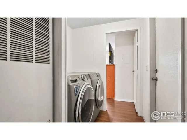 a hallway with a washer and dryer