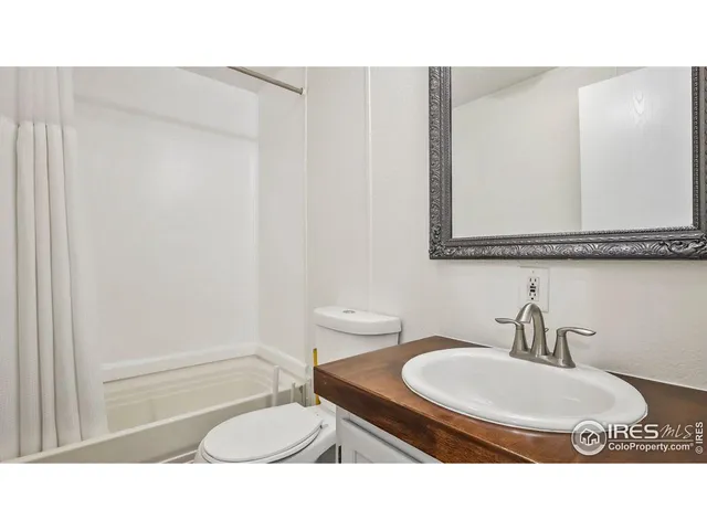a bathroom with a sink double vanity and a mirror